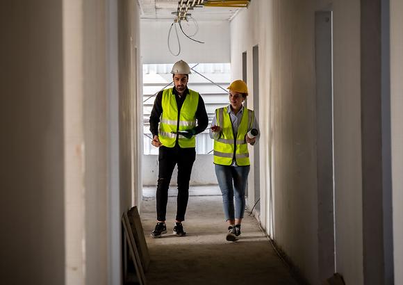 Site mangers on site inspecting progress